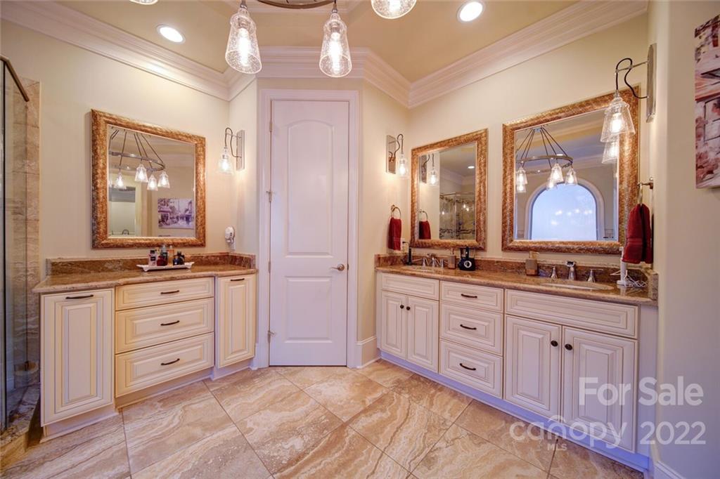 174 Birdie Drive Stanley, NC 28164 - Photo 23 of 46 a spacious bathroom with a granite countertop sink mirror and a