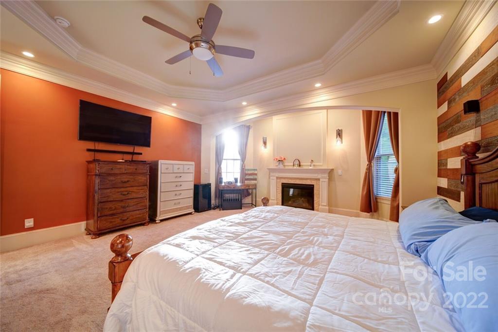 174 Birdie Drive Stanley, NC 28164 - Photo 24 of 46 a bed room with a bed and a television