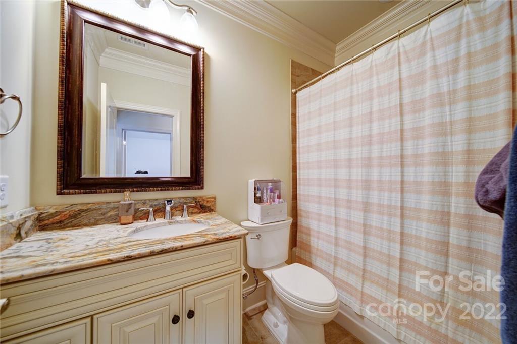 174 Birdie Drive Stanley, NC 28164 - Photo 27 of 46 a bathroom with a granite countertop sink mirror vanity and toilet