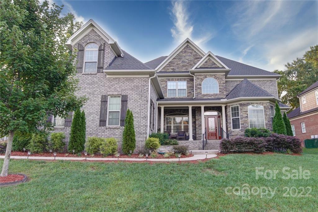 174 Birdie Drive Stanley, NC 28164 - Photo 3 of 46 a front view of a house with a yard and porch
