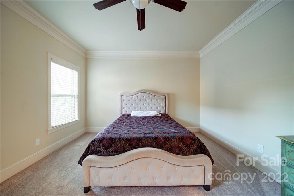 174 Birdie Drive Stanley, NC 28164 - Photo 31 of 46 a bedroom with a bed and window