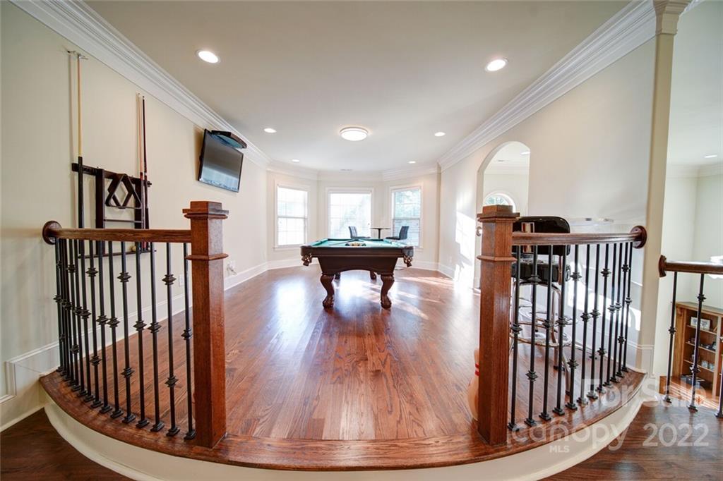 174 Birdie Drive Stanley, NC 28164 - Photo 33 of 46 a view of a hallway with wooden floor and stairs