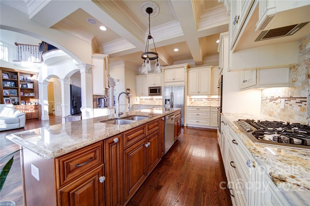 174 Birdie Drive Stanley, NC 28164 - Photo 4 of 46 a kitchen with stainless steel appliances a sink stove and refrigerator