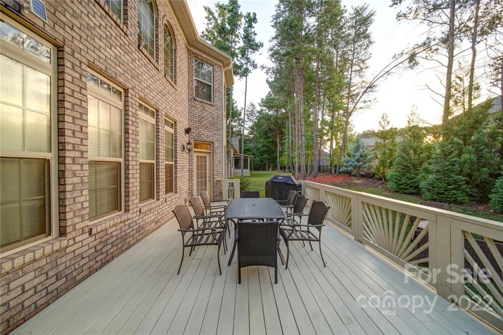 174 Birdie Drive Stanley, NC 28164 - Photo 42 of 46 a view of a deck with furniture and wooden floor