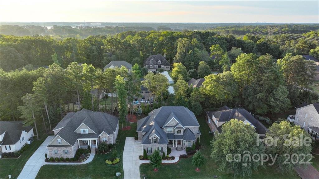 174 Birdie Drive Stanley, NC 28164 - Photo 46 of 46 an aerial view of a house with a garden and mountains in the back