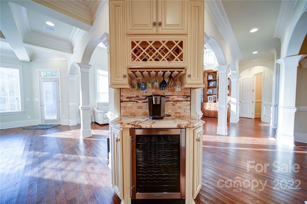 174 Birdie Drive Stanley, NC 28164 - Photo 7 of 46 a view of living room kitchen with furniture and fireplace