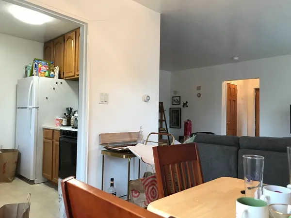 a living room with furniture fireplace and a table