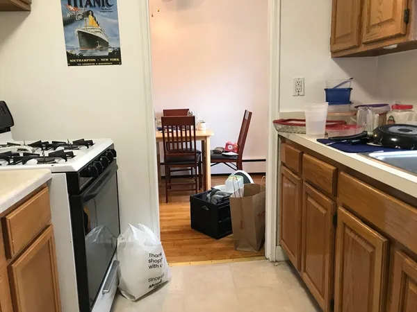a kitchen with a stove and a refrigerator