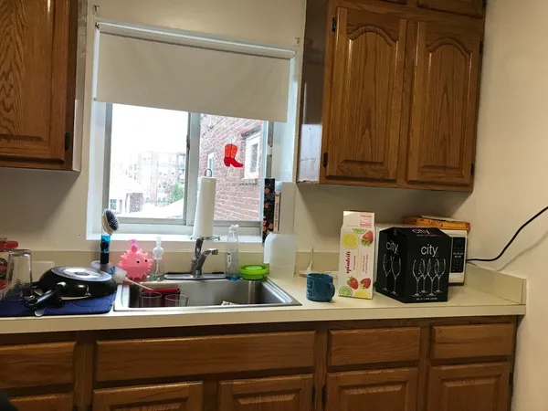 a kitchen with a sink and cabinets