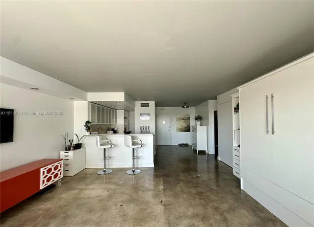 a bathroom with a toilet a sink and shower