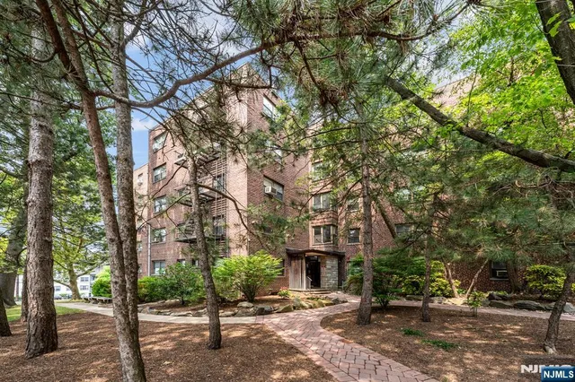 a view of house with trees in the background