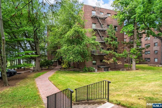a view of a patio with table and chairs and potted plants