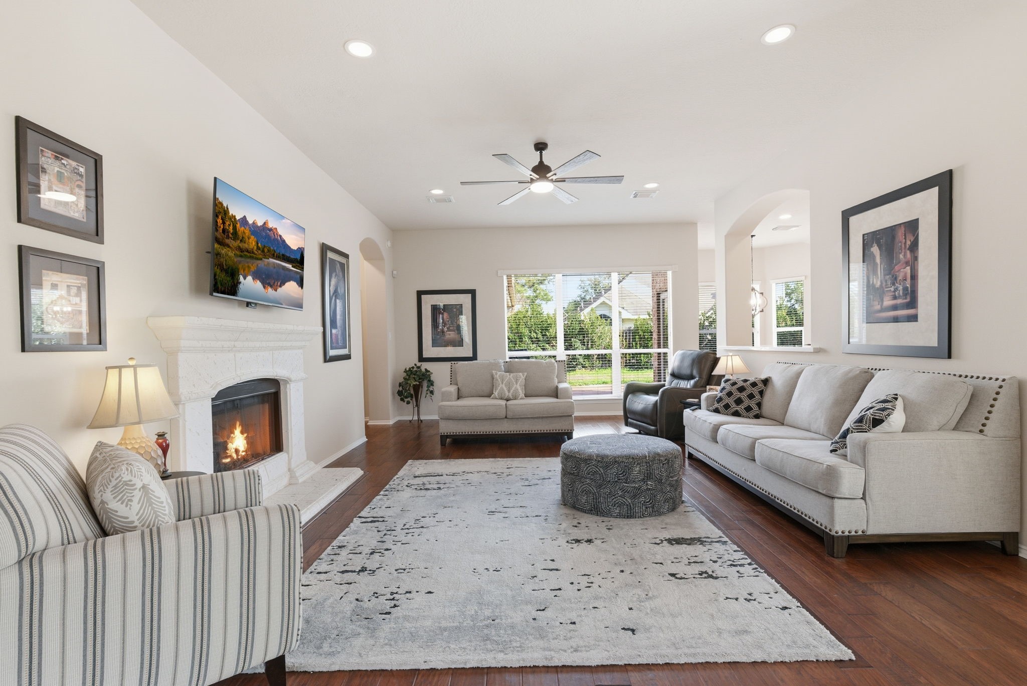29814 Legends Pass Lane Spring, TX 77386 - Photo 14 of 46 a living room with furniture a fireplace and a flat screen tv
