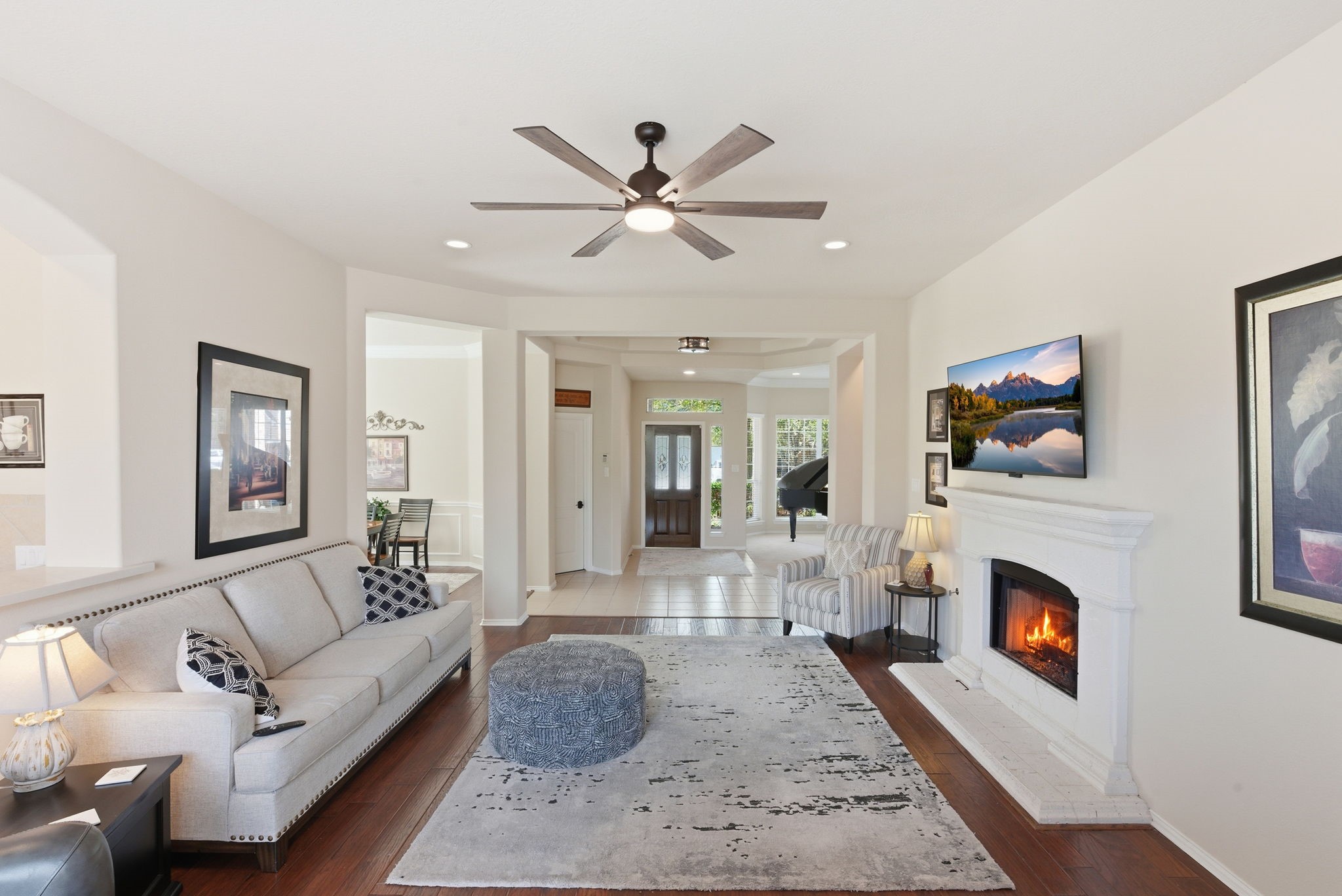 29814 Legends Pass Lane Spring, TX 77386 - Photo 17 of 46 a living room with furniture a flat screen tv and a fireplace