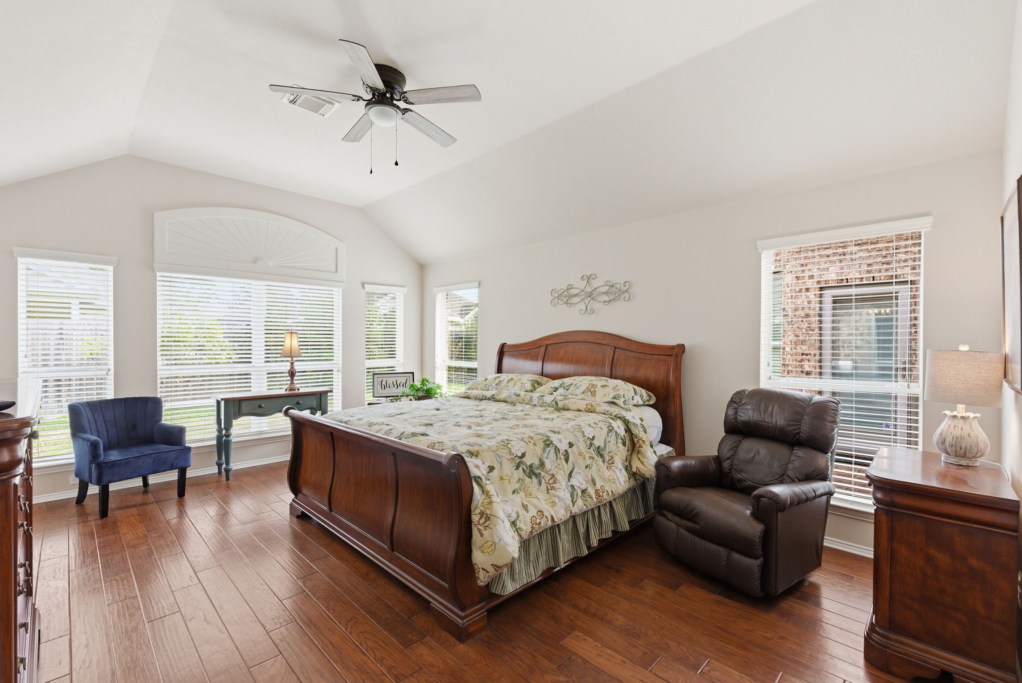 29814 Legends Pass Lane Spring, TX 77386 - Photo 29 of 46 a bedroom with a bed couch and a large window