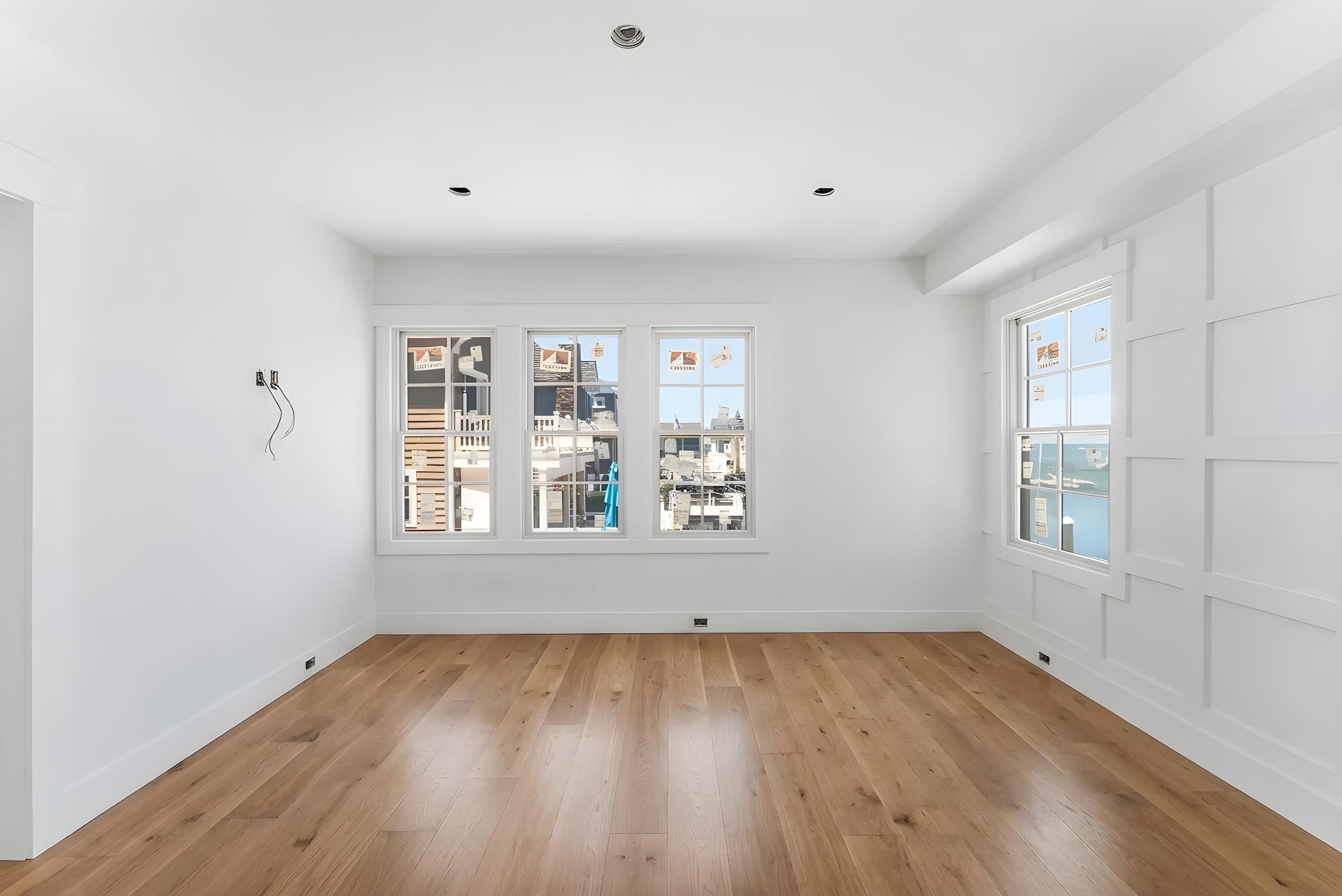 8527 3rd Stone Harbor, NJ 08247 - Photo 9 of 28 an empty room with wooden floor and windows