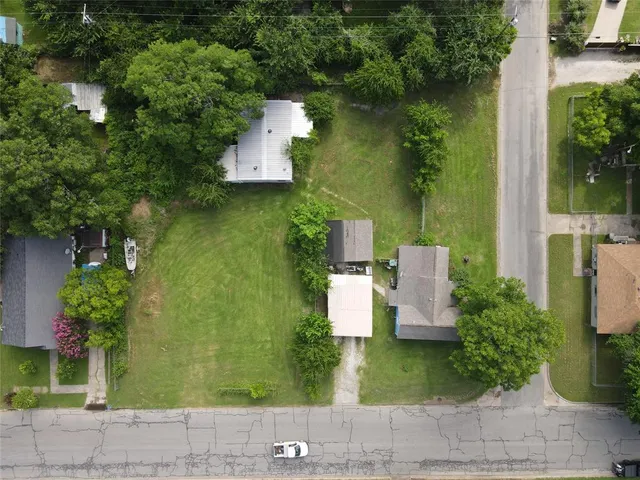 a aerial view of a house with garden space and sitting area
