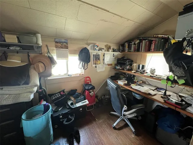 a room with gym equipment and a view of living room