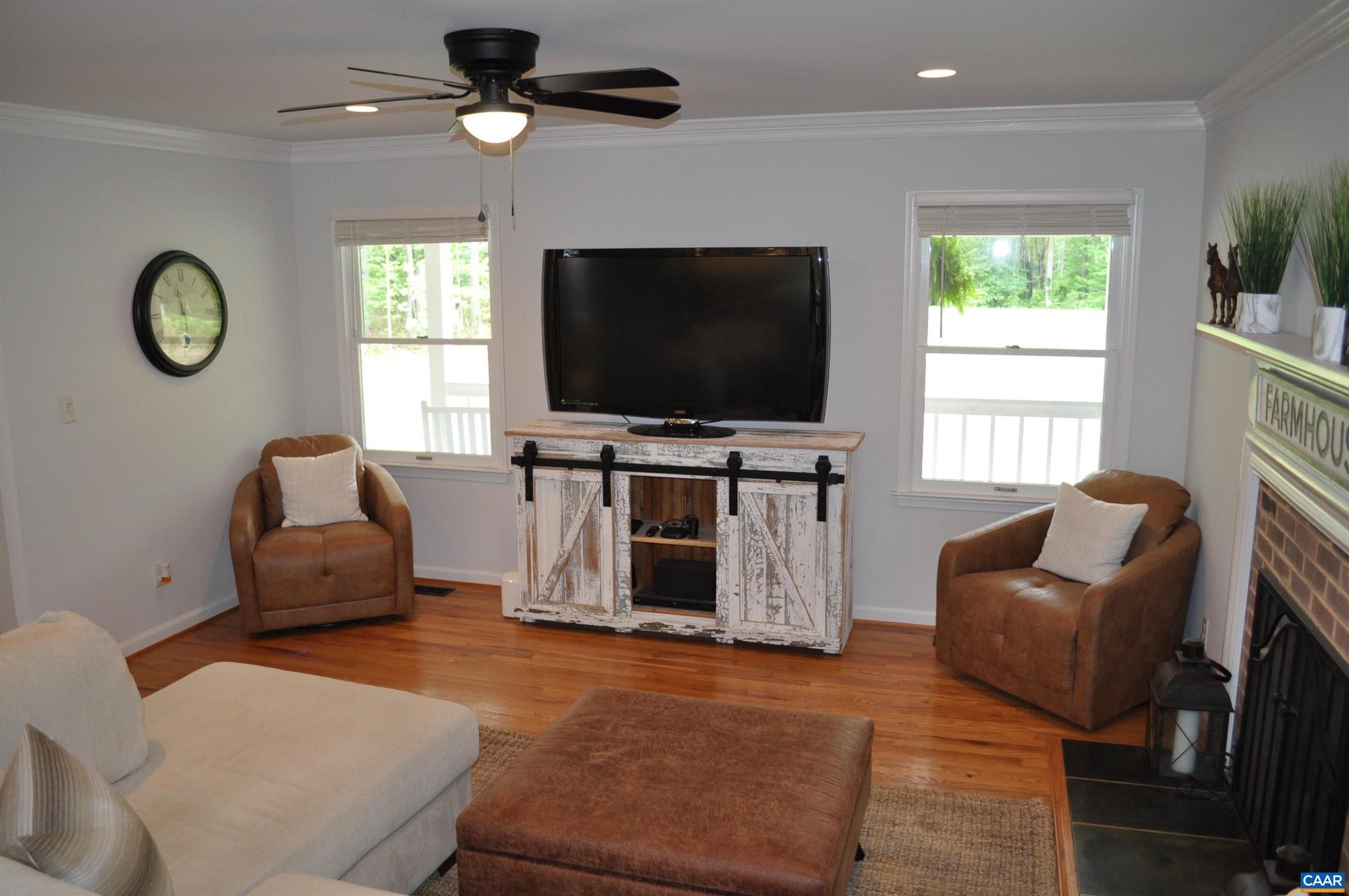 3257 Martin Kings Road Charlottesville, VA 22902 - Photo 6 of 49 a living room with furniture a flat screen tv and a window