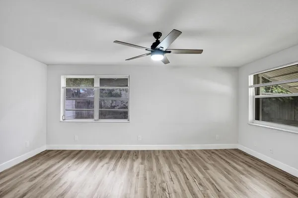 a view of an empty room with a window