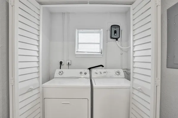 a kitchen with stainless steel appliances granite countertop a refrigerator a stove and a sink
