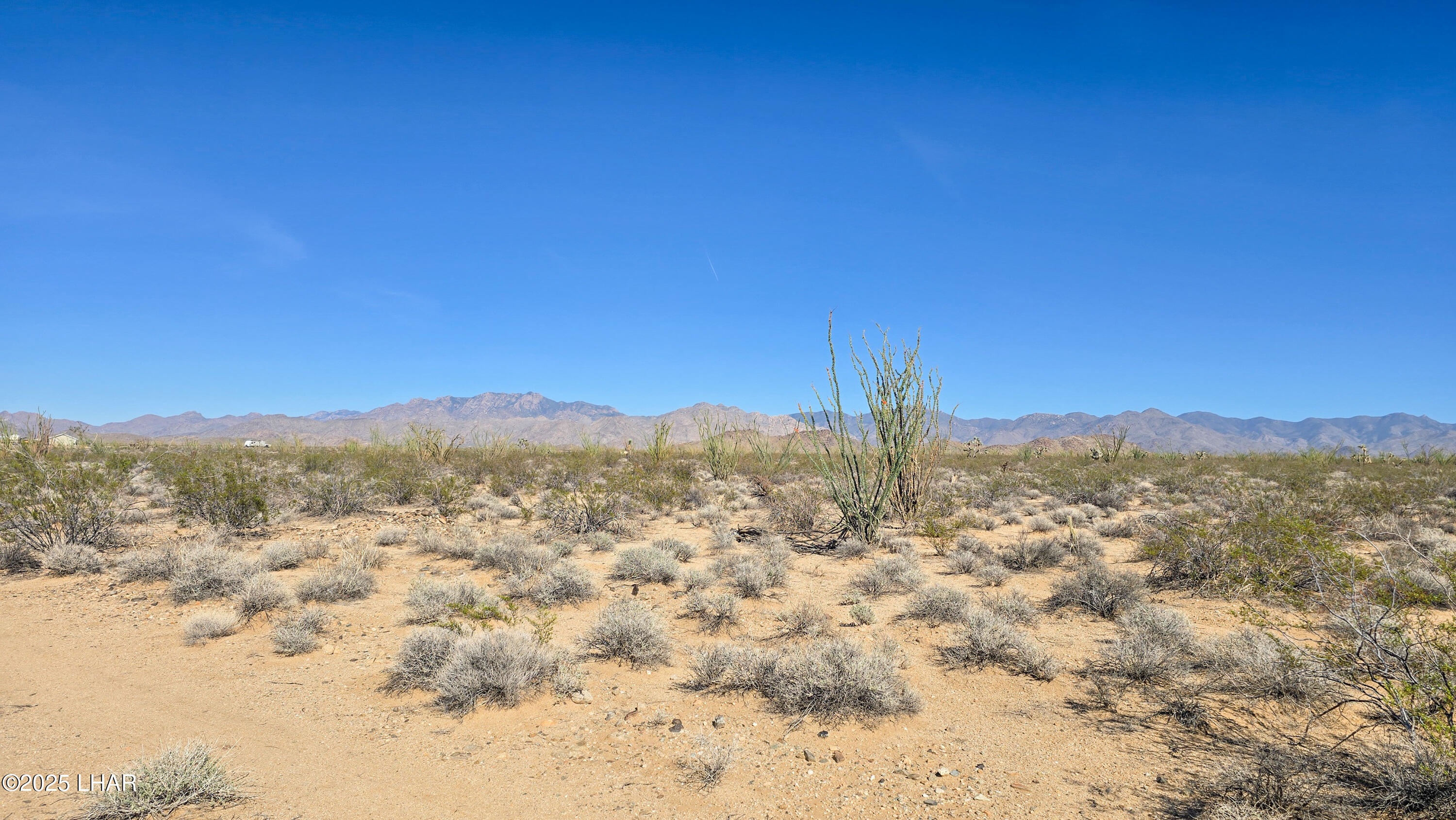 4-acres South Ray Road Yucca, AZ 86438 - Photo 14 of 18 a view of a city with mountains in the background