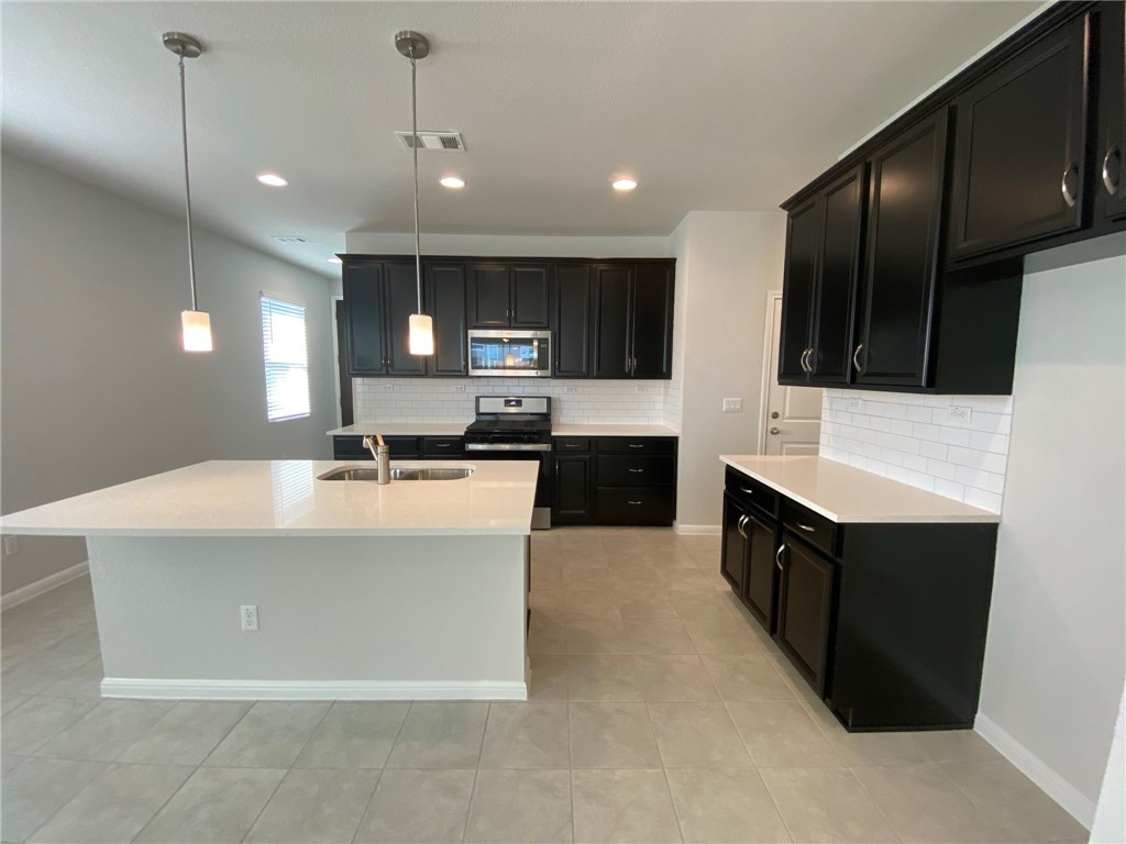 Find a comfy counter stool and enjoy socializing around the center island or your cup of Joe in the morning.