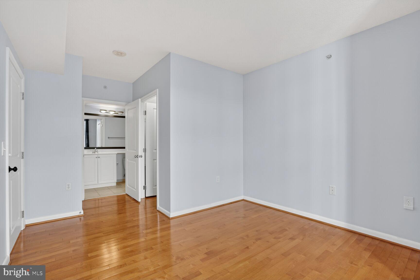 851 North Glebe Road, Unit 417 Arlington, VA 22203 - Photo 15 of 38 a view of empty room with wooden floor