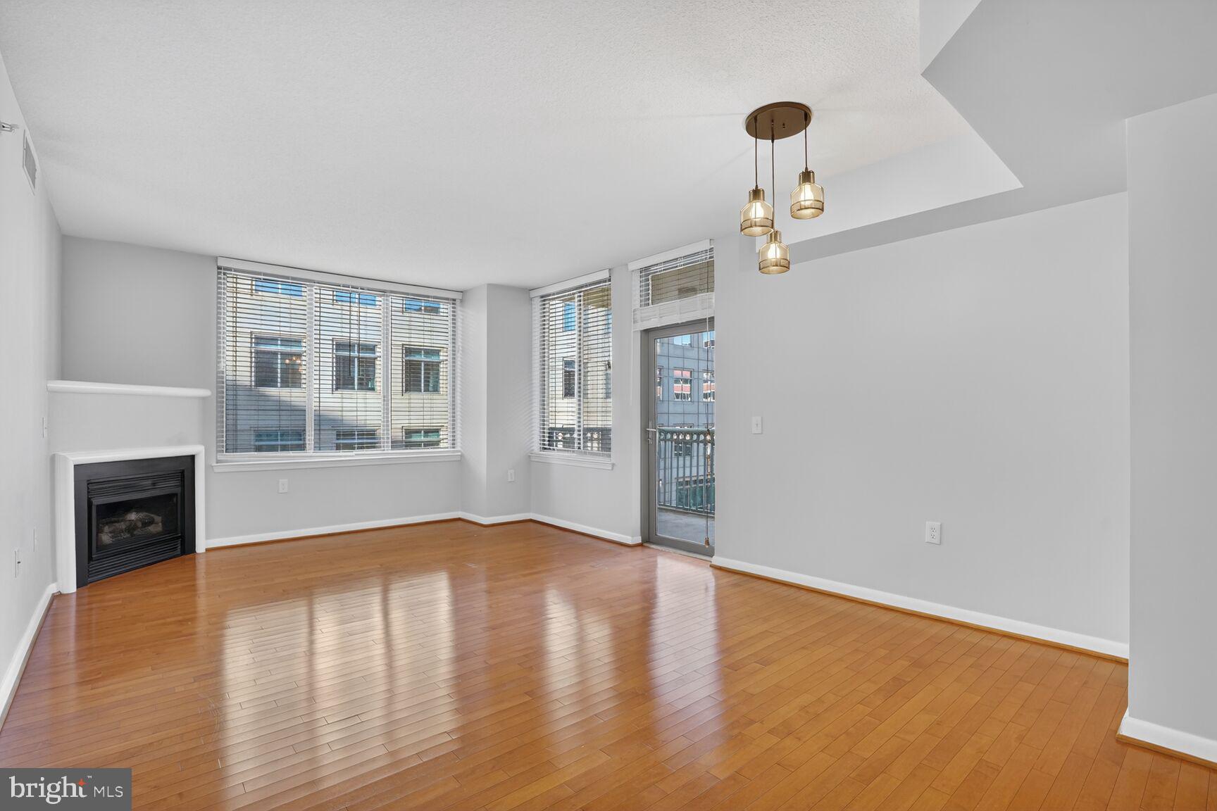 851 North Glebe Road, Unit 417 Arlington, VA 22203 - Photo 3 of 38 wooden floor in an empty room with a window