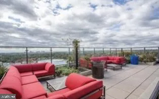 a swimming pool with outdoor seating and yard