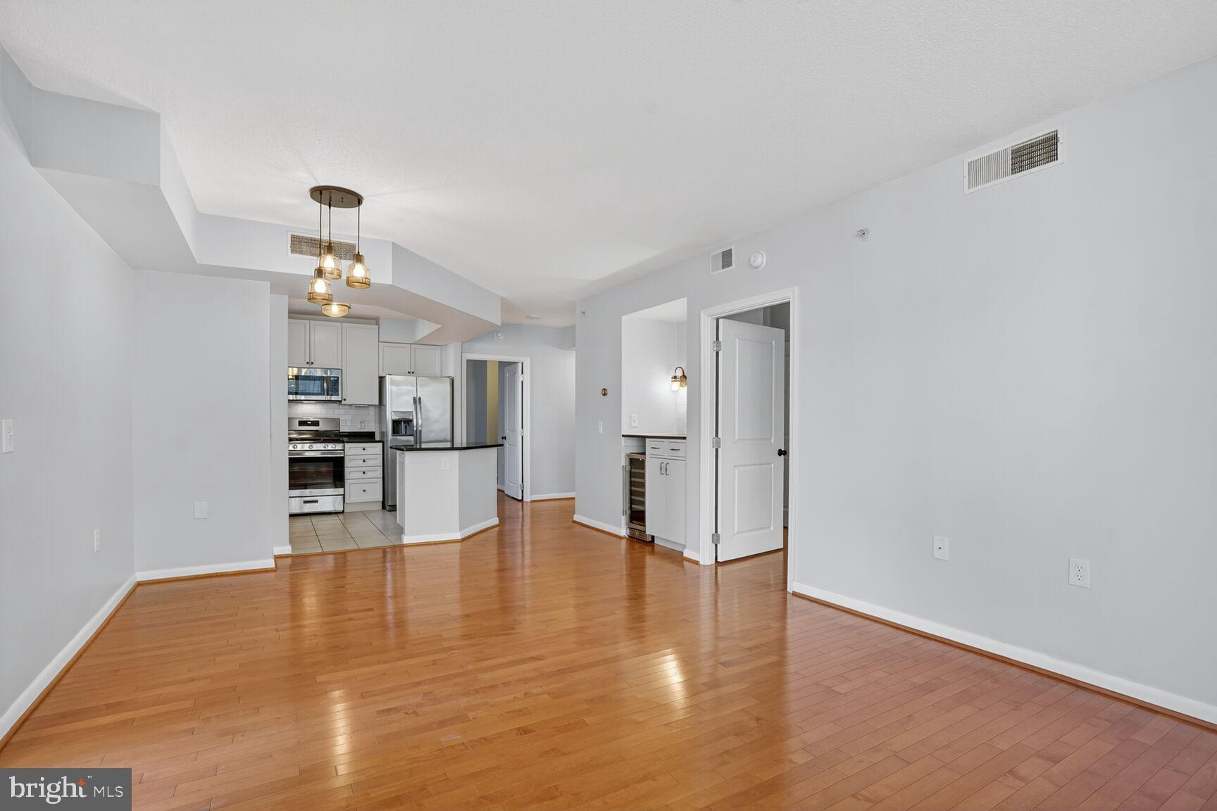 851 North Glebe Road, Unit 417 Arlington, VA 22203 - Photo 6 of 38 a view of a kitchen with wooden floor