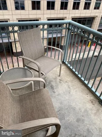 a view of swimming pool with outdoor seating