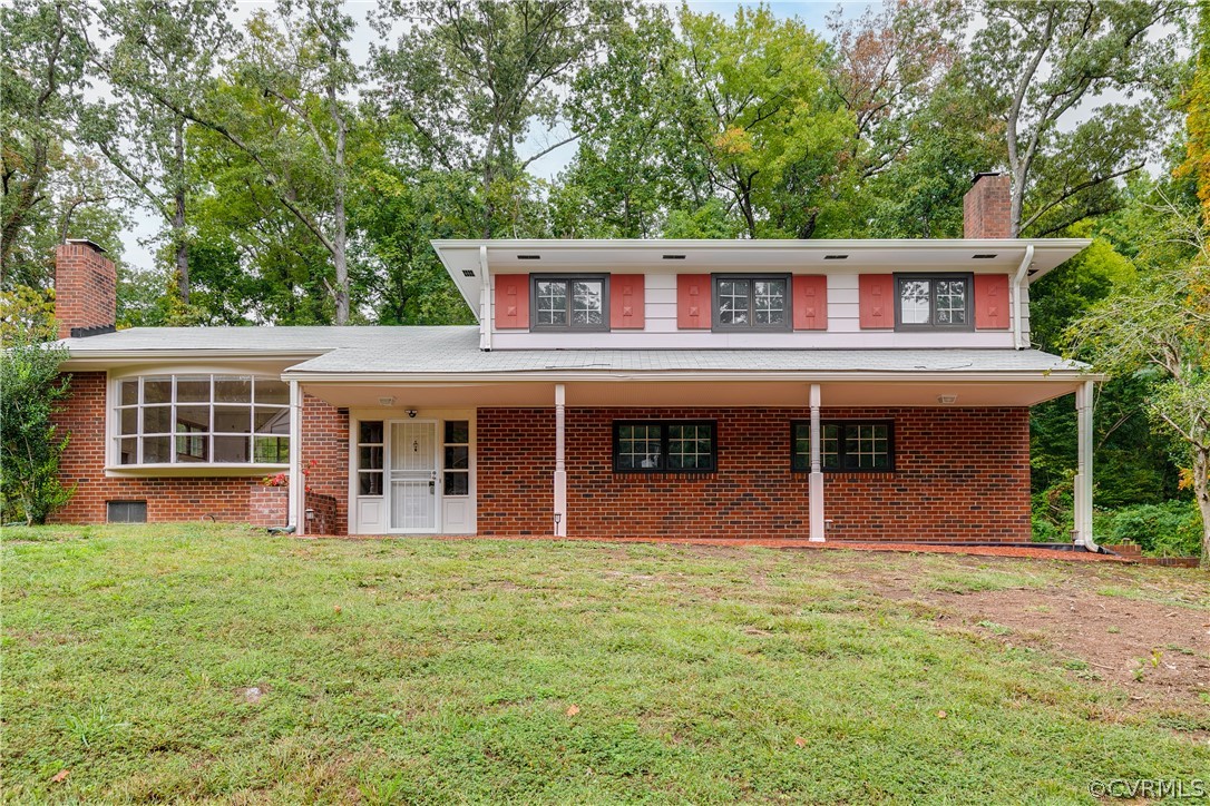 8946 Cherokee Road Richmond, VA 23235 - Photo 1 of 30 front view of a house with a yard