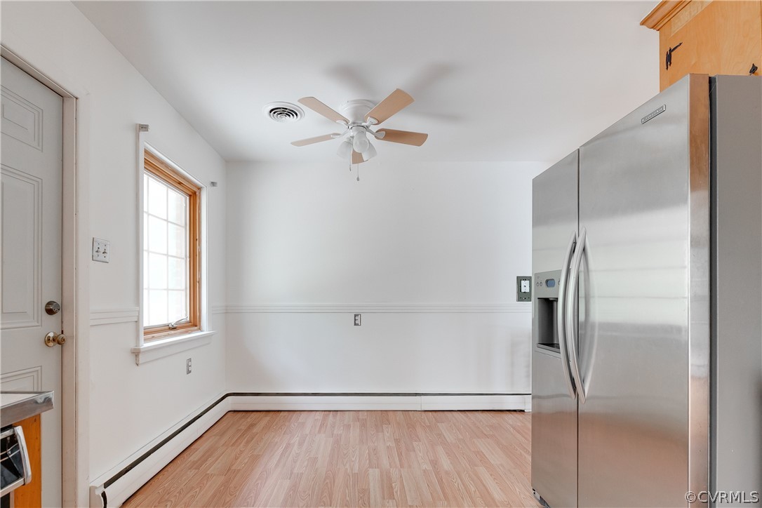 8946 Cherokee Road Richmond, VA 23235 - Photo 11 of 30 a view of a room with a ceiling fan and a window