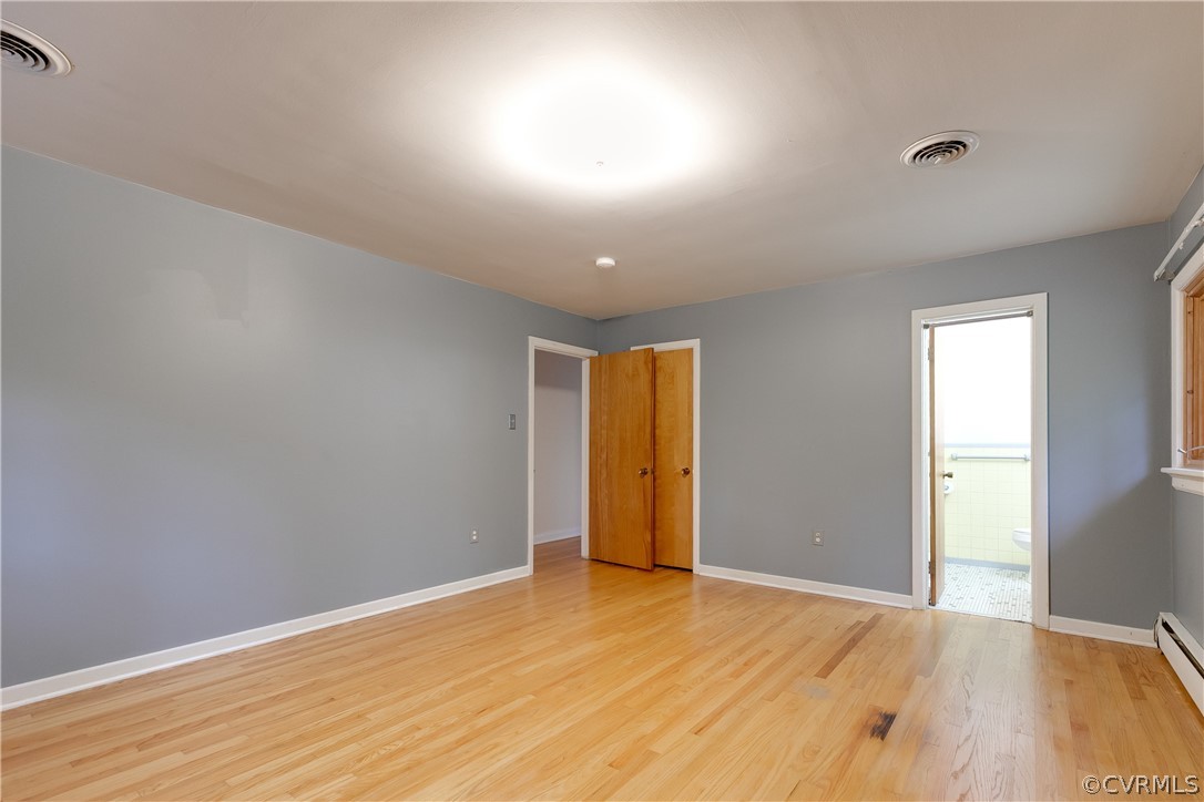 8946 Cherokee Road Richmond, VA 23235 - Photo 19 of 30 a view of empty room with wooden floor and fan