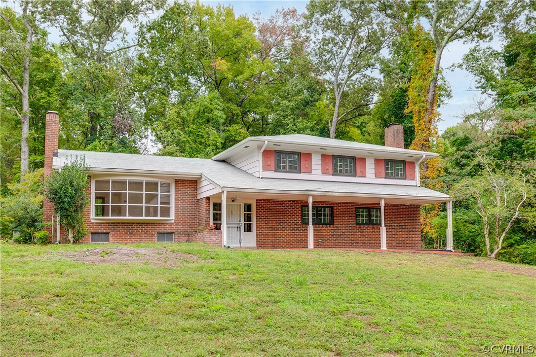 8946 Cherokee Road Richmond, VA 23235 - Photo 2 of 30 a view of a house with yard and tree s
