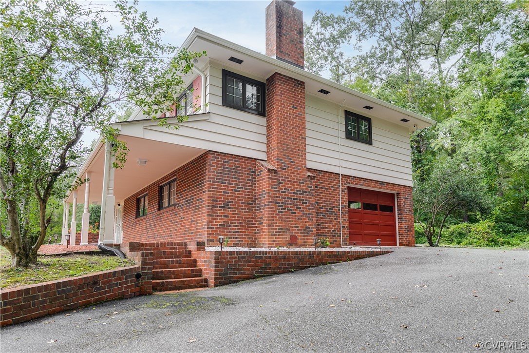 8946 Cherokee Road Richmond, VA 23235 - Photo 28 of 30 a view of a house with a garage