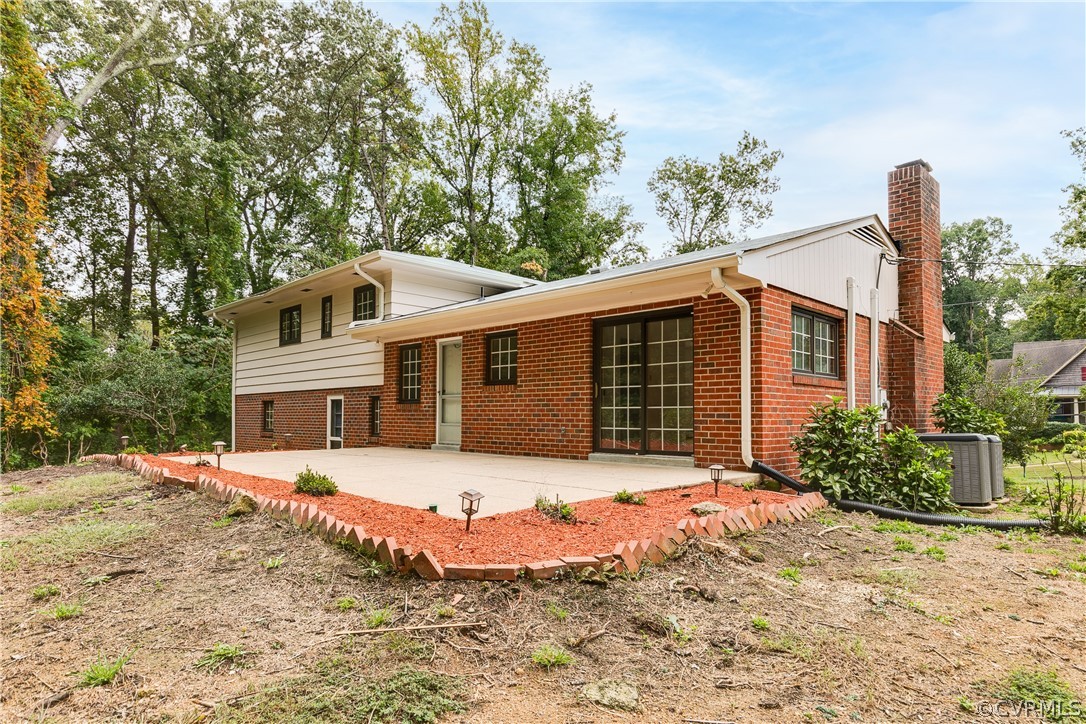 8946 Cherokee Road Richmond, VA 23235 - Photo 29 of 30 a front view of a house with a yard and garage