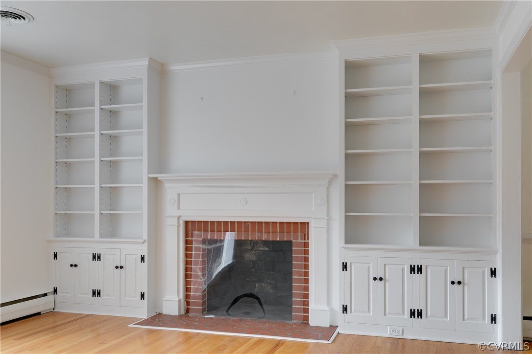 8946 Cherokee Road Richmond, VA 23235 - Photo 5 of 30 a view of a livingroom with shelves