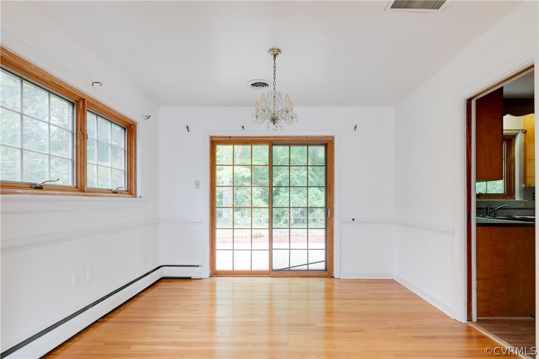 8946 Cherokee Road Richmond, VA 23235 - Photo 7 of 30 a view of an empty room with glass door