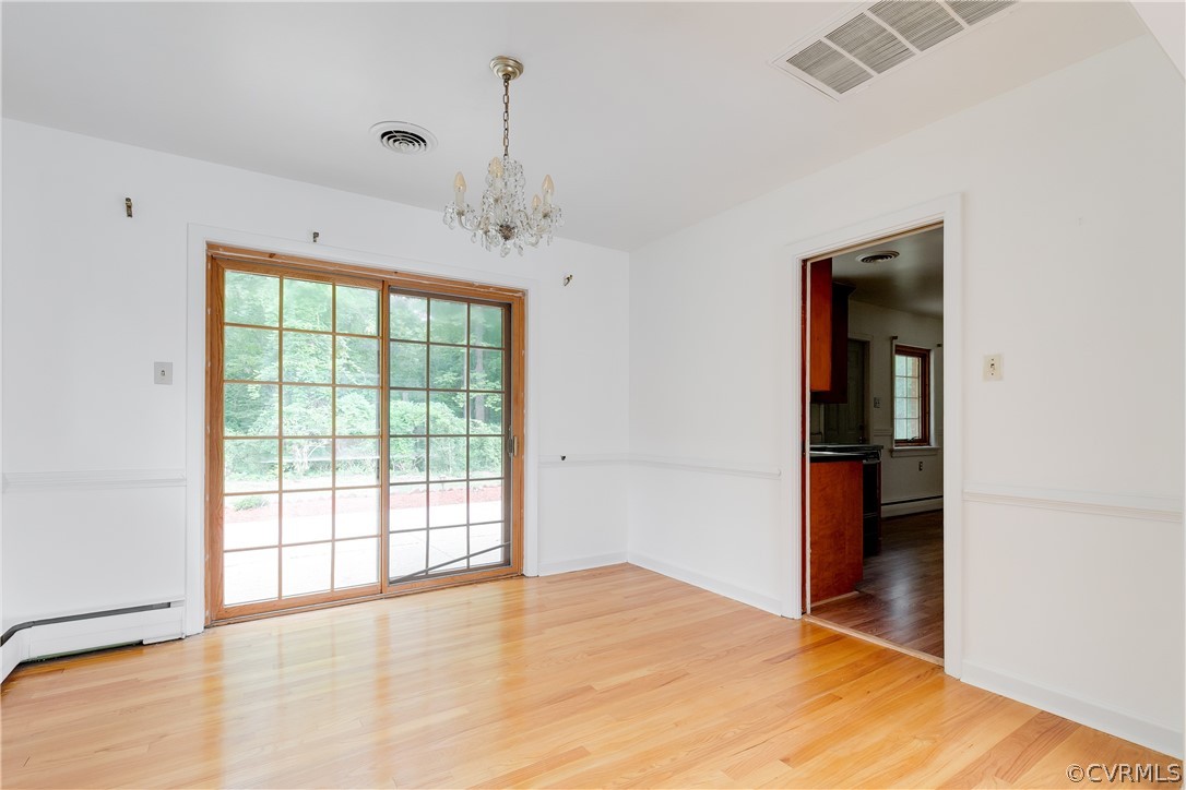8946 Cherokee Road Richmond, VA 23235 - Photo 8 of 30 a view of an empty room with a window