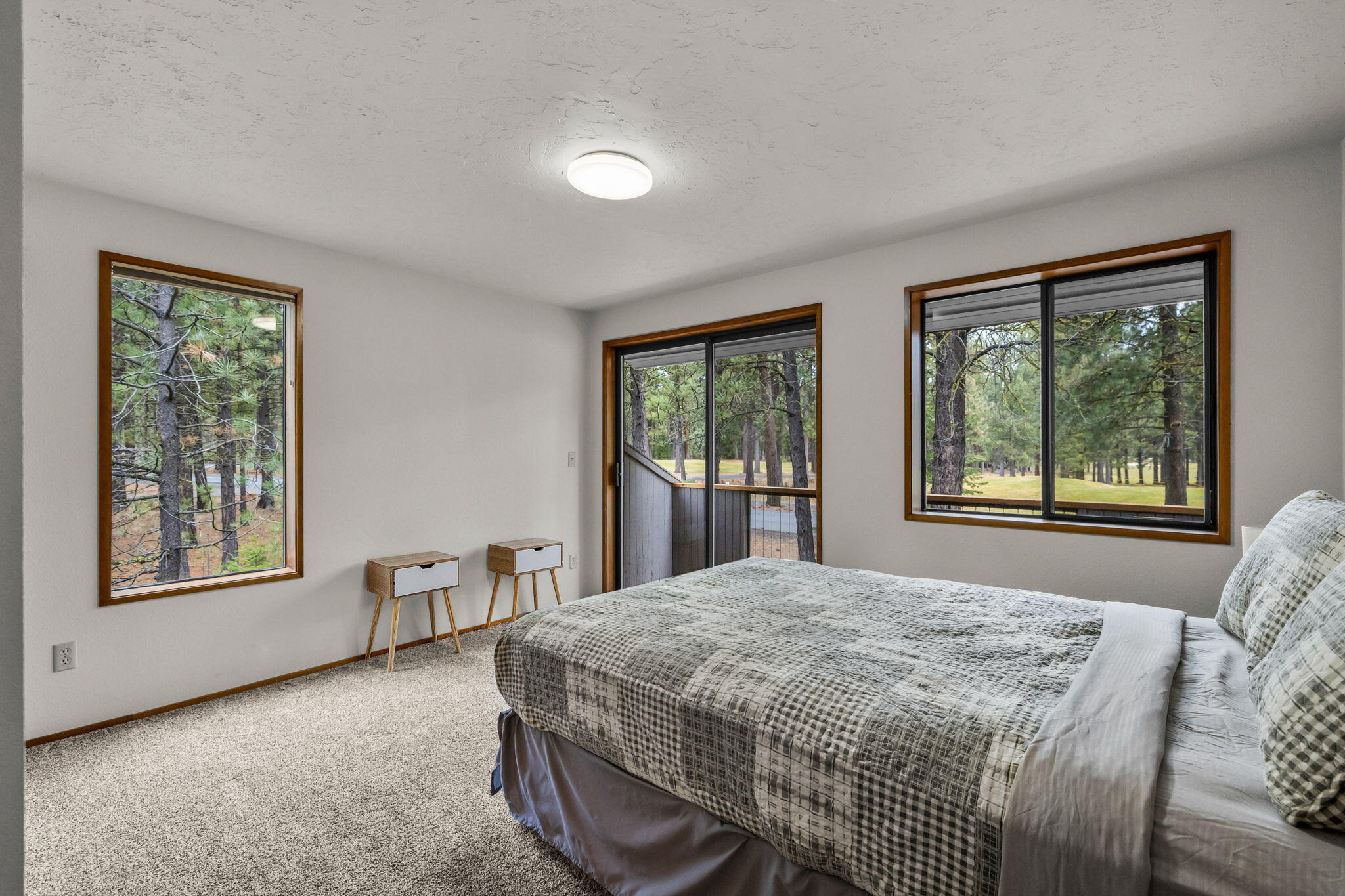 13168 Hawks Beard Black Butte Ranch, OR 97759 - Photo 32 of 47 a bed sitting in a bedroom next to a window