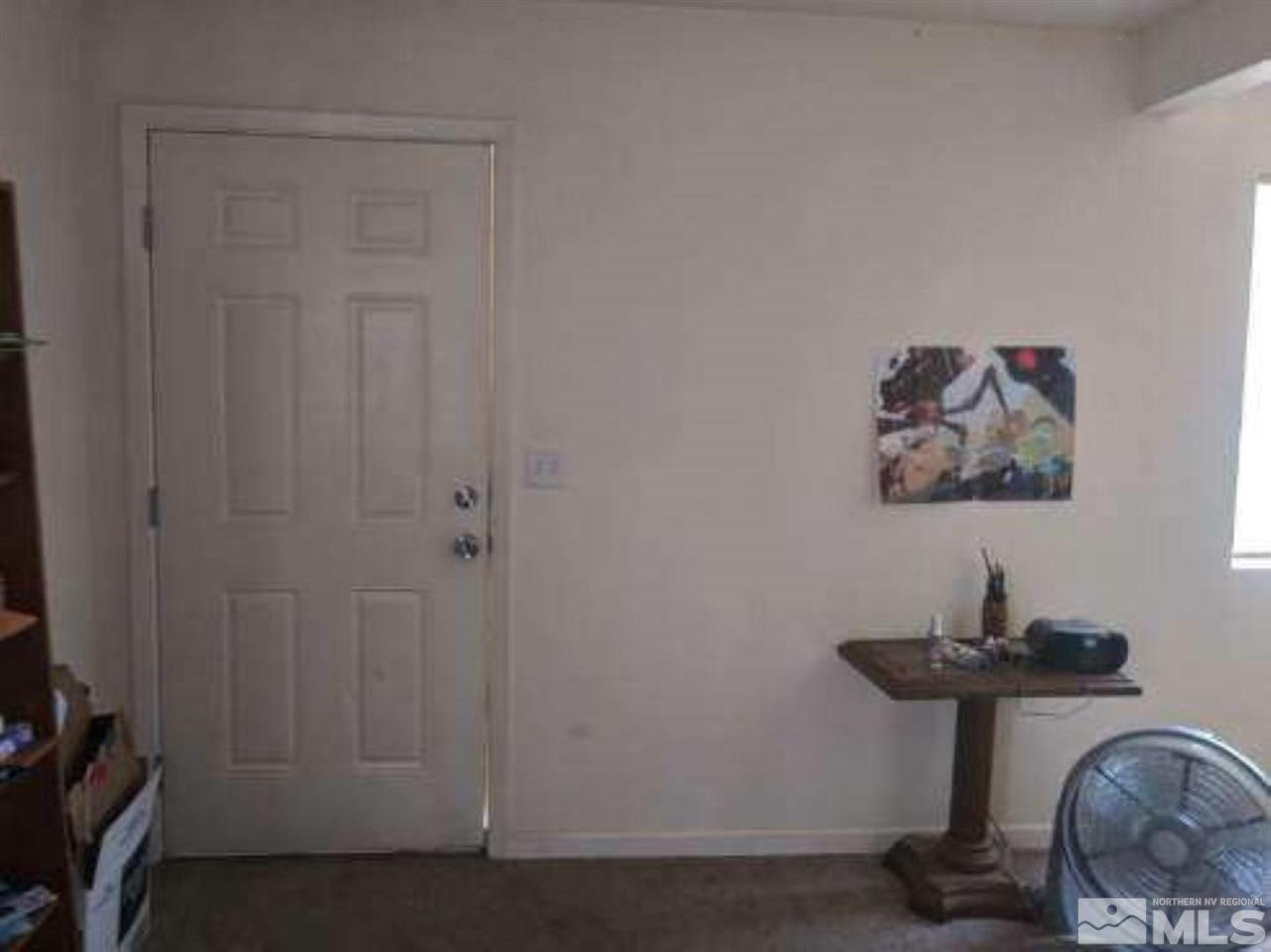 126 E Street Hawthorne, NV 89415 - Photo 11 of 14 a room with computer on a table and chair