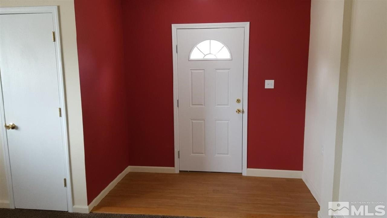 126 E Street Hawthorne, NV 89415 - Photo 2 of 14 a view of a hallway with wooden floor