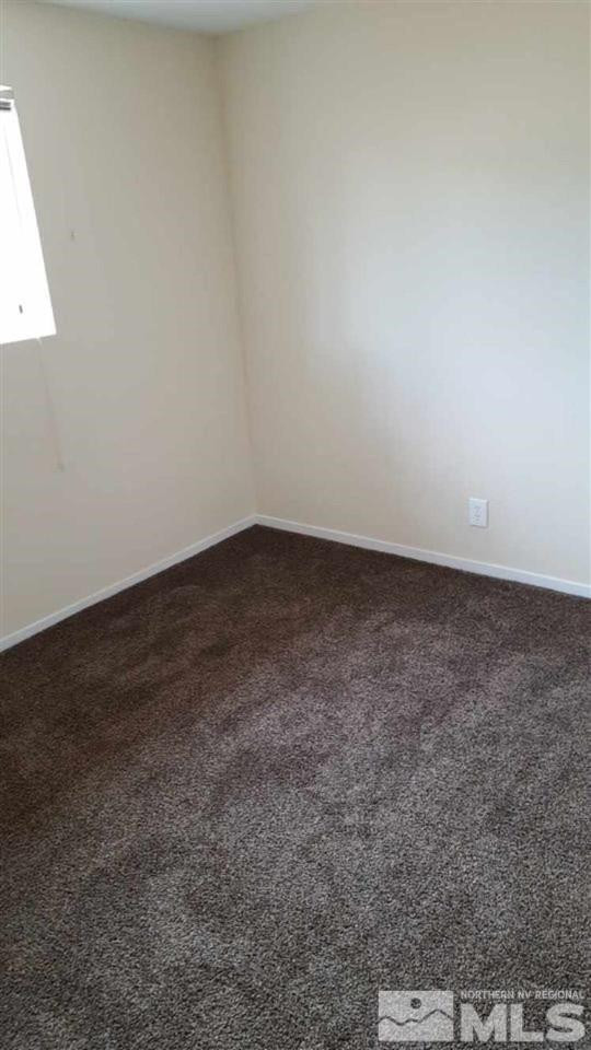 126 E Street Hawthorne, NV 89415 - Photo 3 of 14 an empty room with a bench