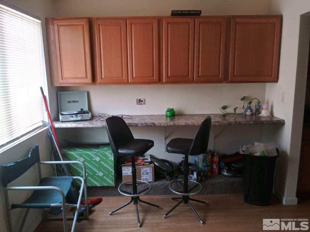 126 E Street Hawthorne, NV 89415 - Photo 10 of 14 a view of a workspace with furniture and a window
