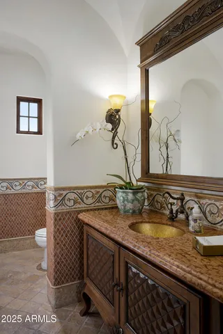 a living room with furniture and a mirror