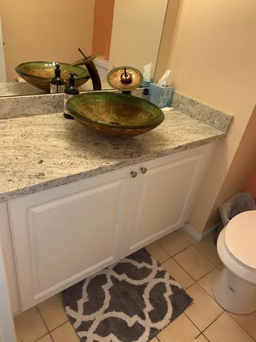 a bathroom with a sink and a toilet