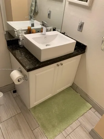 a bathroom with a shower and a toilet