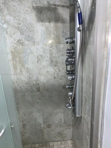 a view of a hallway with wooden floor and stairs